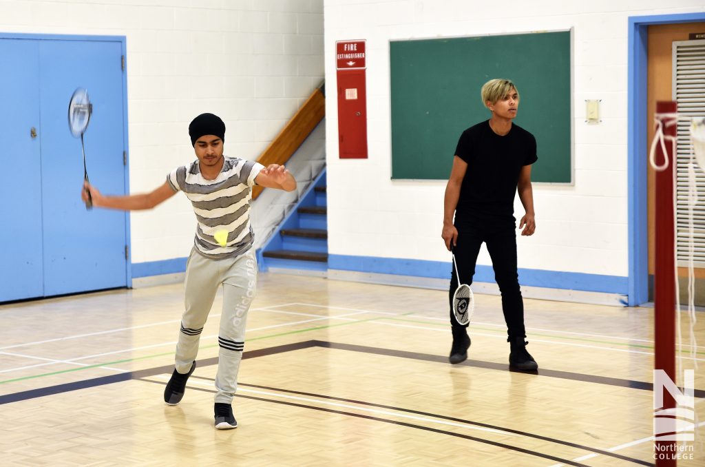 Northern College students in gym playing badminton at Timmins Campus