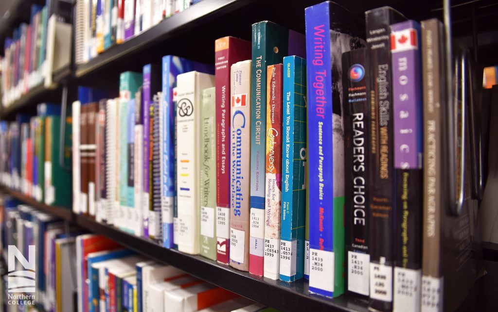 Shelves of textbooks at Northern College Haileybury Campus