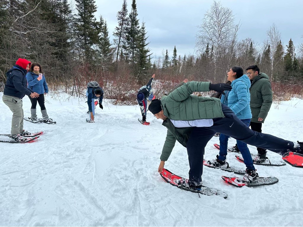 Northern College Students outside snowshoeing