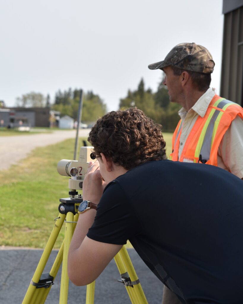 engineering technician students from Northern College with instructor in surveying class outdoor