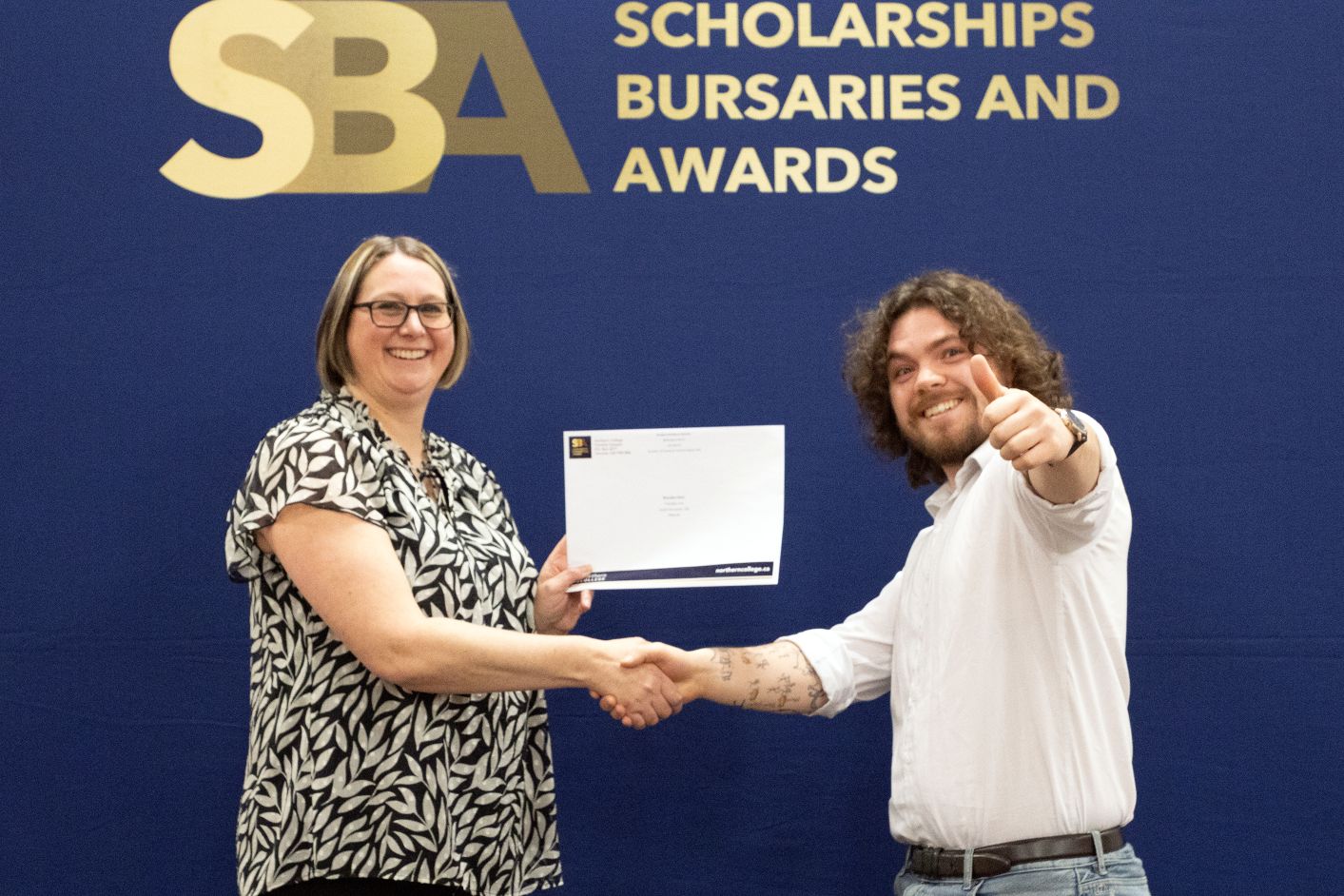 student receiving scholarship