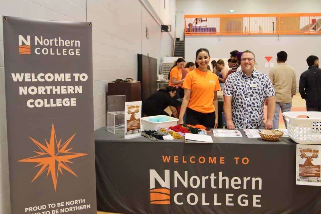 staff gretting new students at orientation at northern college