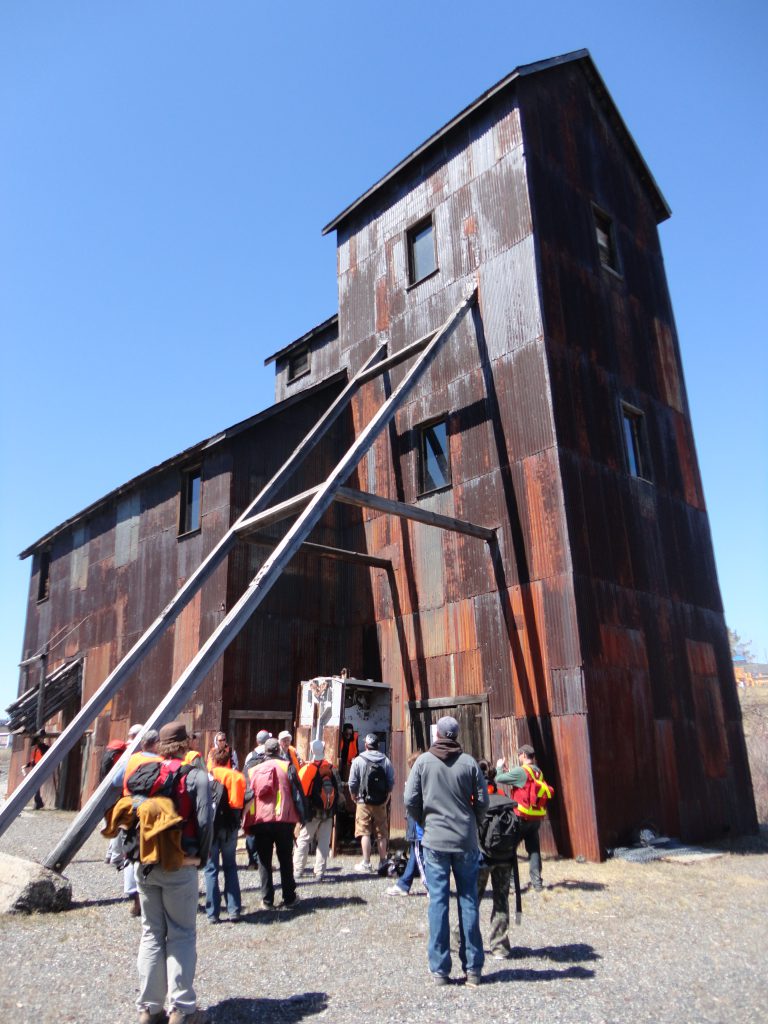 mining field school students at cobalt headframe