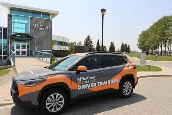 Northern College Driver's Ed instruction car parked outside Timmis Campus