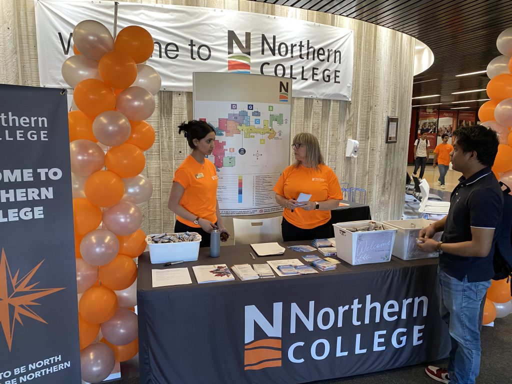Picture of Northern College staff helping students on orientation day