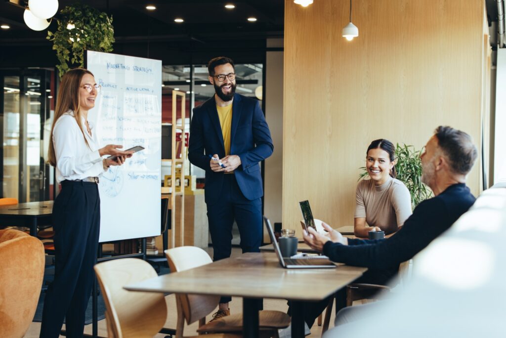 four people in a business meeting in an office