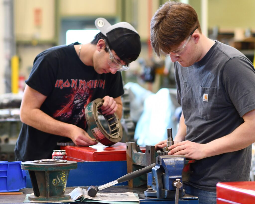 Industrial Millwright students working on machinery in shop class